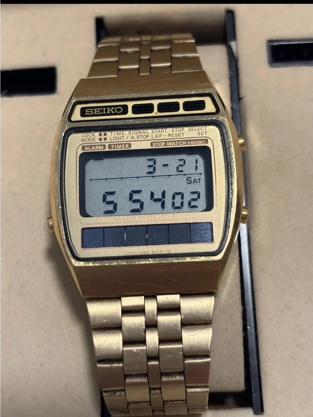 Seiko Men's Digital Quartz Wristwatch Gold Tone A258-5069 with solar panels.
